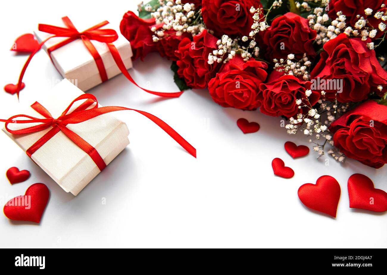 Valentine gift box and red roses bouquet on a white background Stock ...