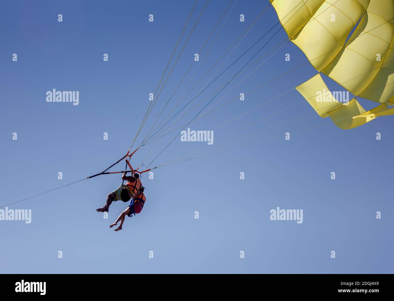 Parasailing: flying over the sea by parachute Stock Photo