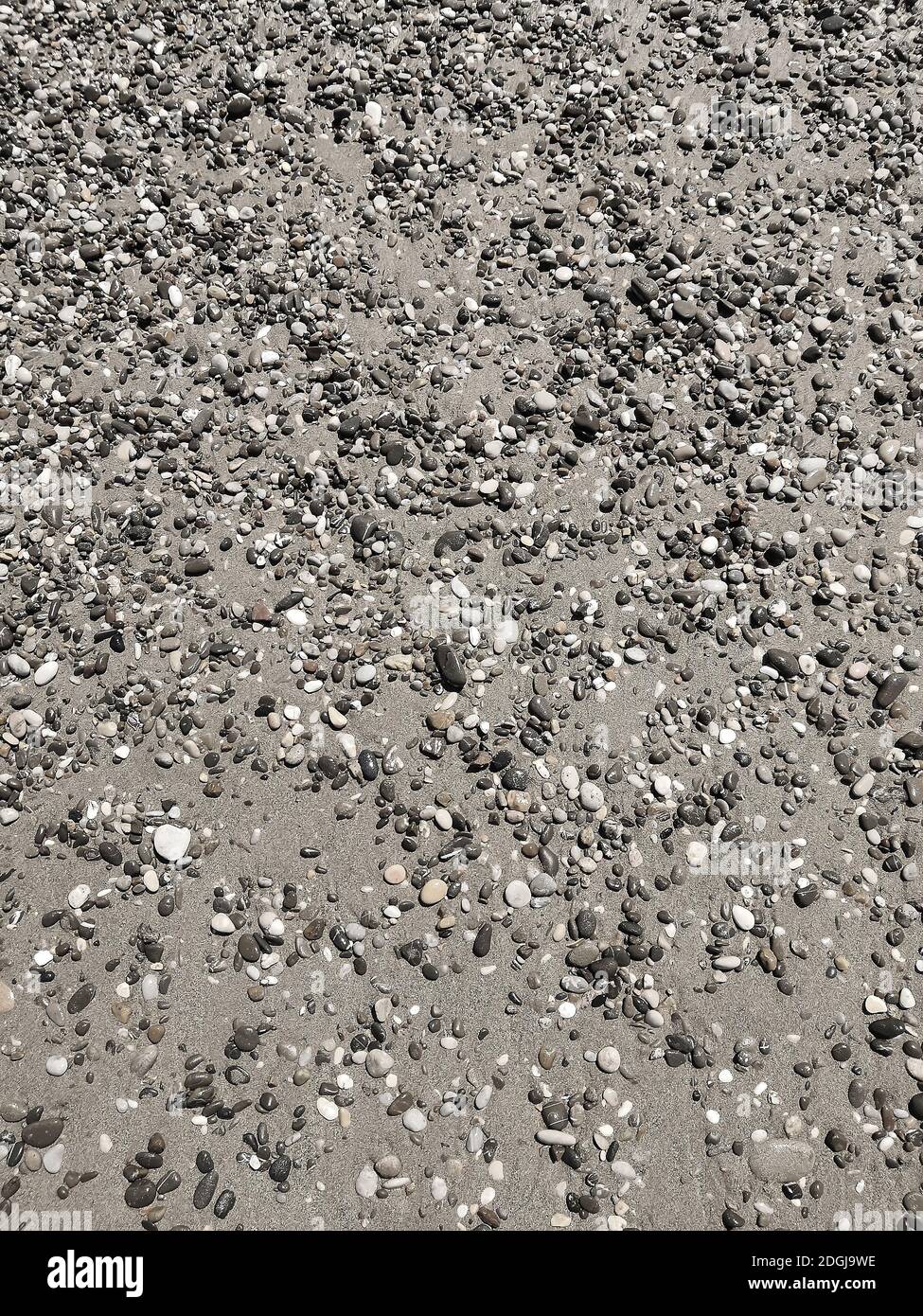 Background image: small sea pebbles on the beach Stock Photo