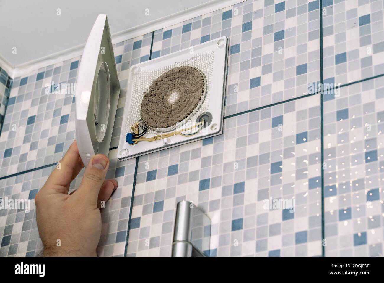 very dirty bathroom exhaust fan. the master cleans the ventilation in