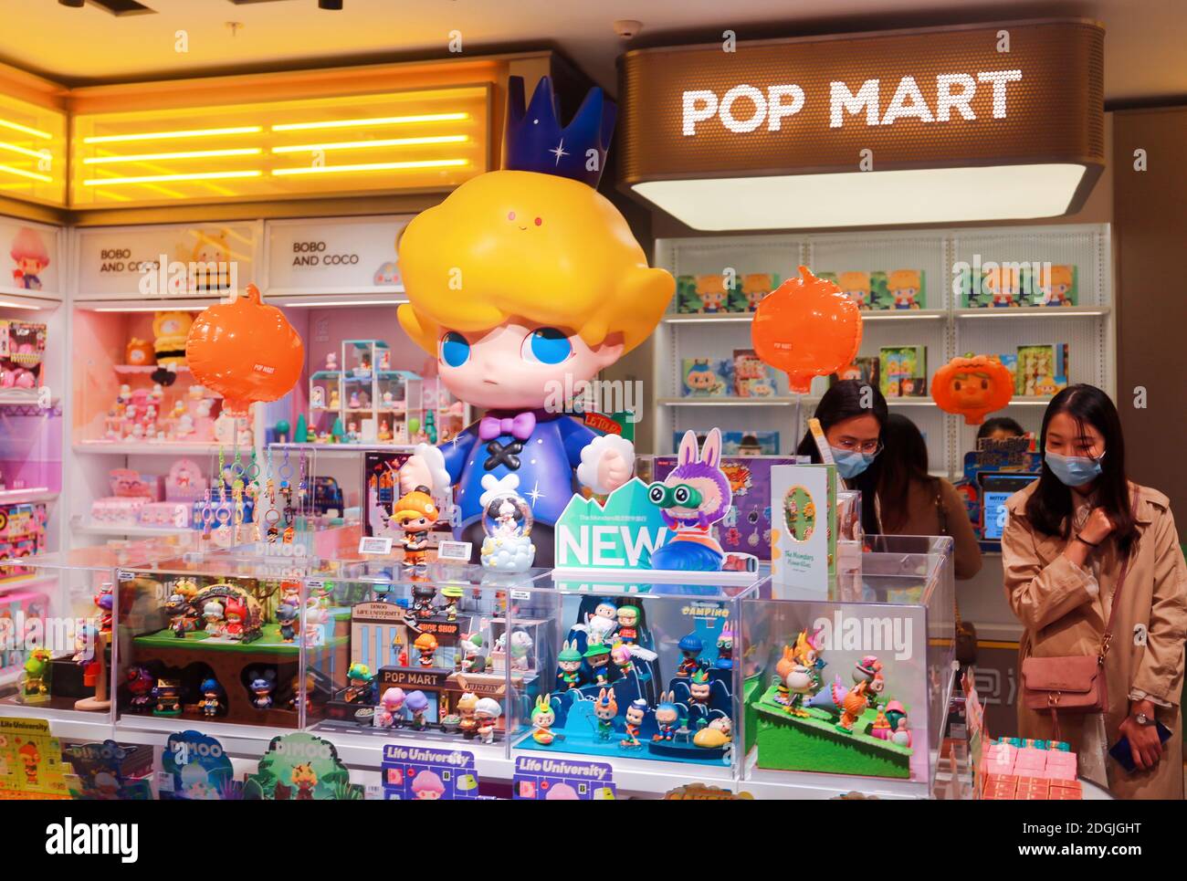 FILE--Customers wander and select products at a Pop Mart