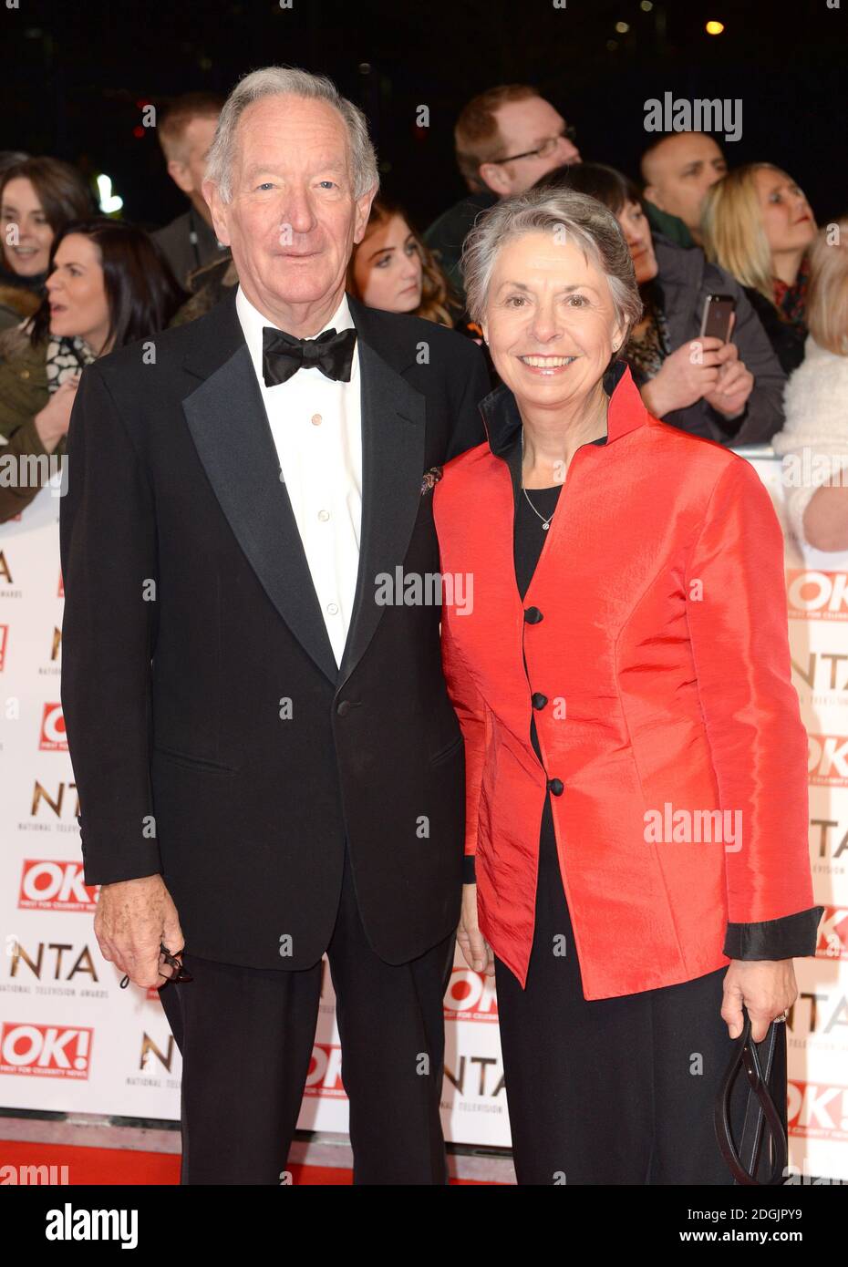 Michael Buerk and wife Christine on the red carpet at the National Television Awards 2015 held at the O2 Arena, London.  This year the NTA's are celebrating their 20th year. Stock Photo