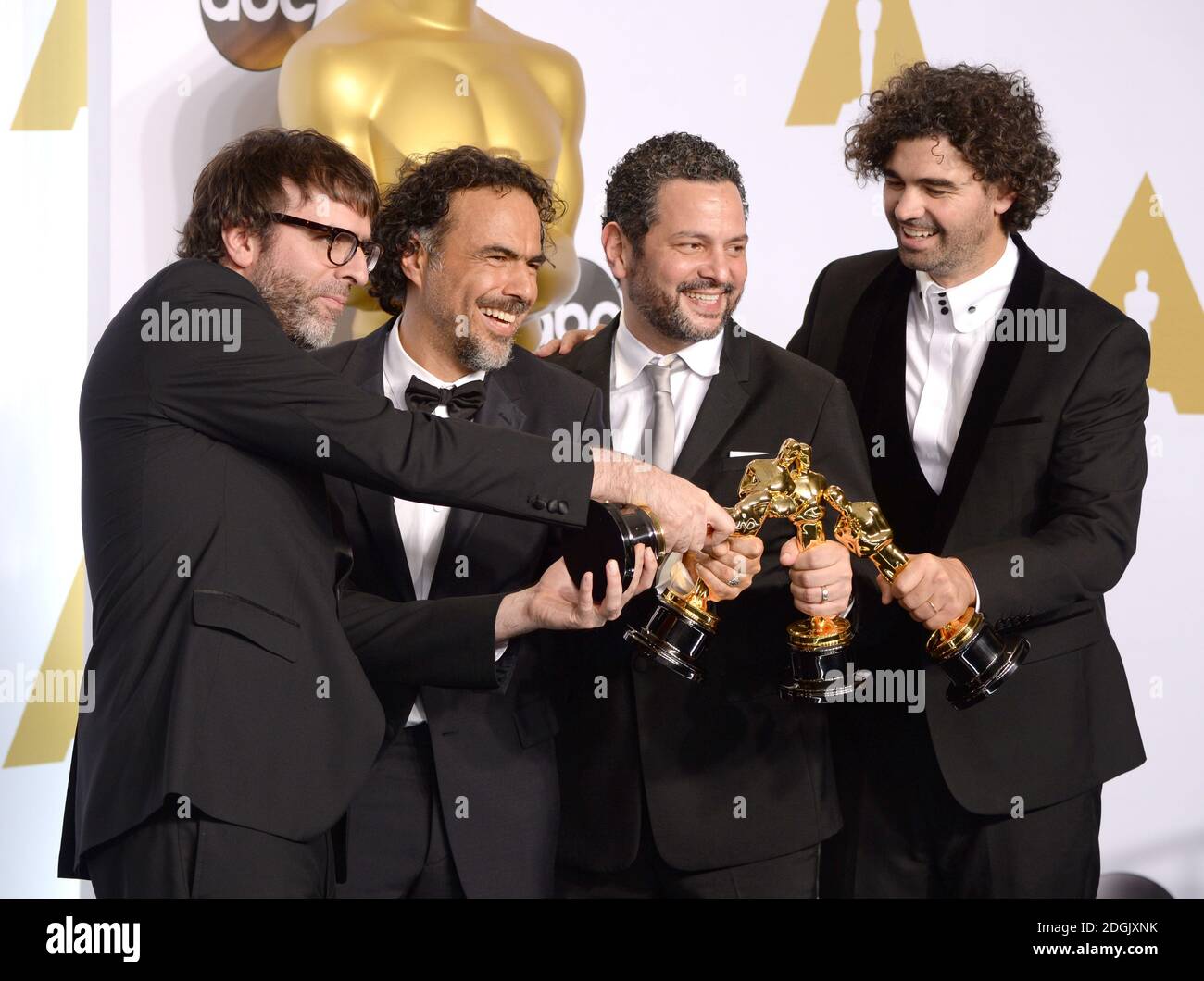 (left to right) Producer James W. Skotchdopole, actor Sean Penn, producer/director Alejandro G. Inarritu, winner of Best Original Screenplay, Best Director, and Best Motion Picture, for 'Birdman' and producer John Lesher, in the press room of the 87th Academy Awards held at the Dolby Theatre in Hollywood, Los Angeles, CA, USA, February 22, 2015. Stock Photo