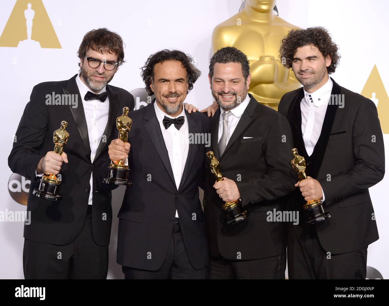 (left to right) Producer James W. Skotchdopole, actor Sean Penn, producer/director Alejandro G. Inarritu, winner of Best Original Screenplay, Best Director, and Best Motion Picture, for 'Birdman' and producer John Lesher, in the press room of the 87th Academy Awards held at the Dolby Theatre in Hollywood, Los Angeles, CA, USA, February 22, 2015. Stock Photo