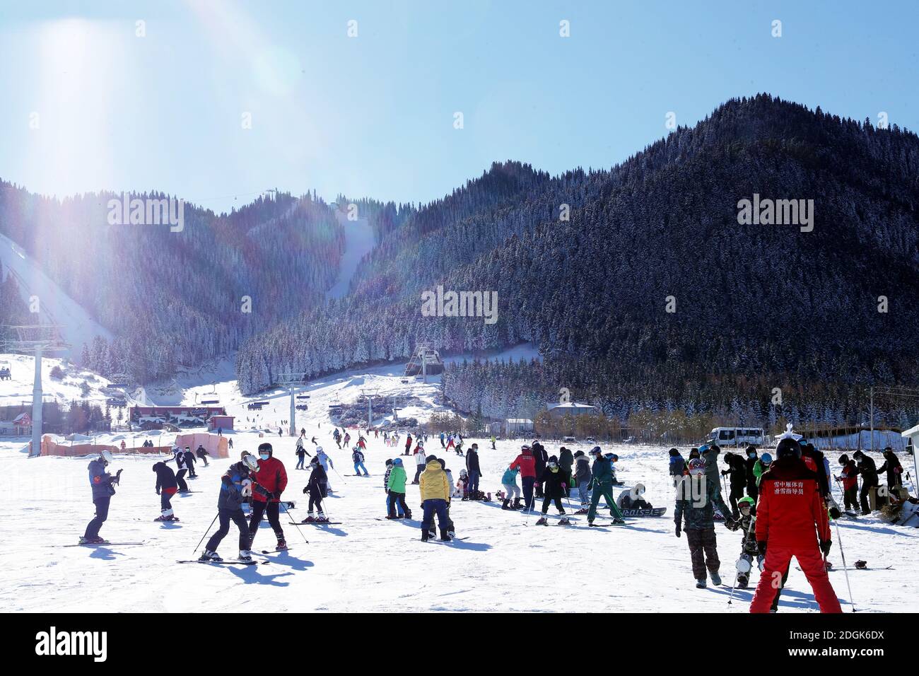 Visitors ski at the Silkroad Resort in Urumqi city, northwest China's Xinjiang Uyghur autonomous region, 21 November 2020. Stock Photo