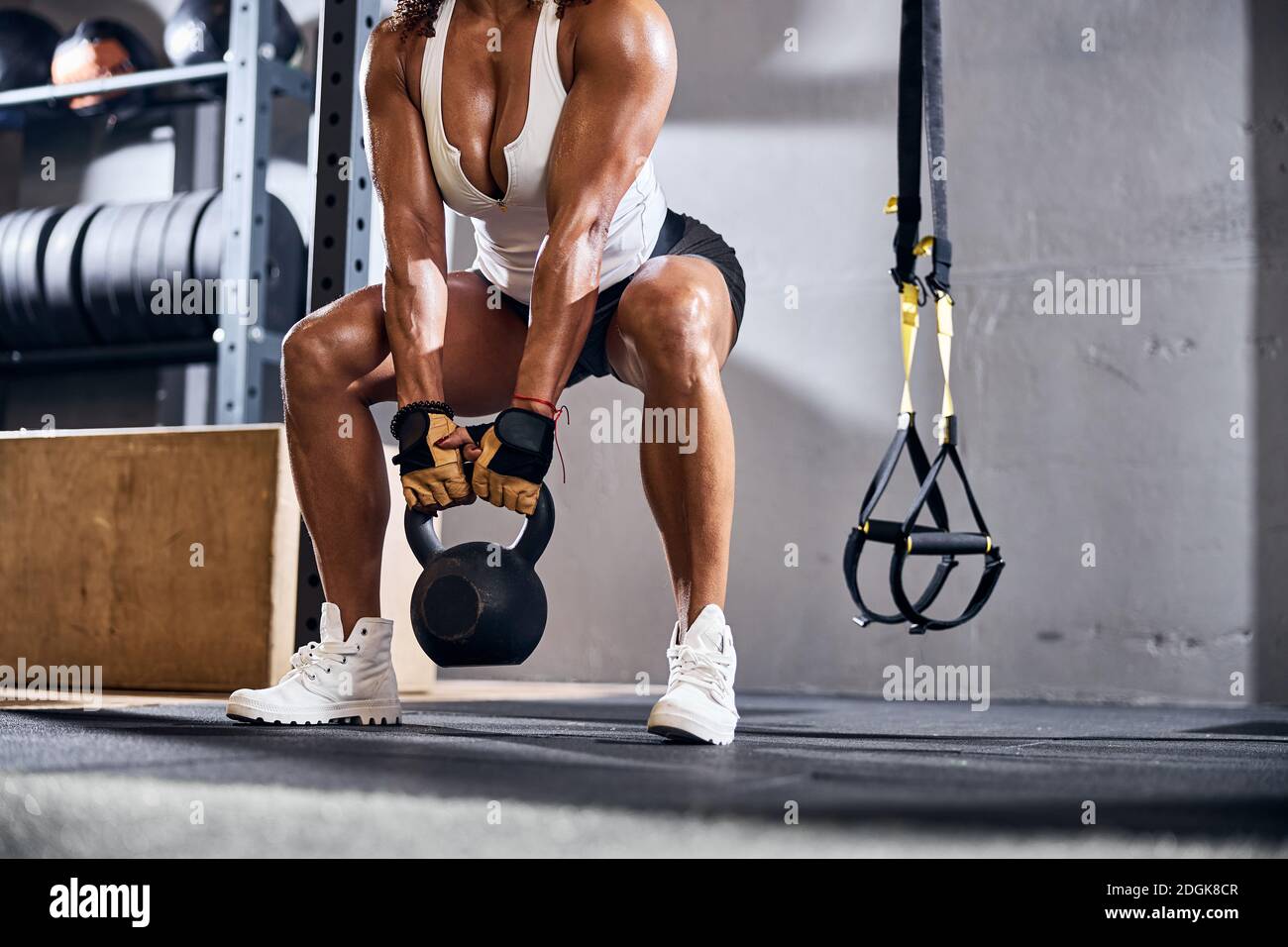 Muscular lady athlete lifting weights at the gym Stock Photo Alamy
