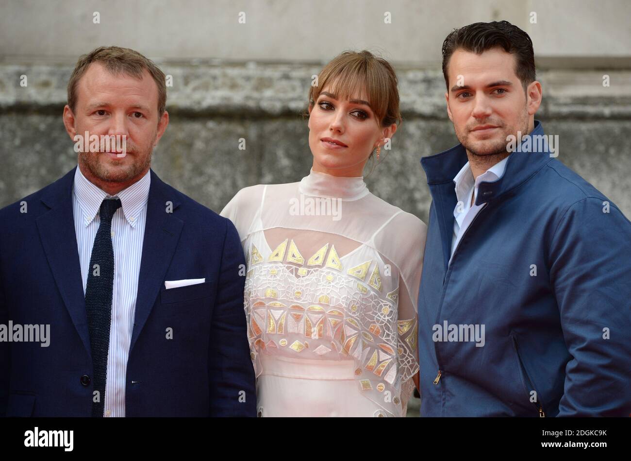 Henry Cavill, Guy Ritchie and wife Jacqui Ainsley arriving at The