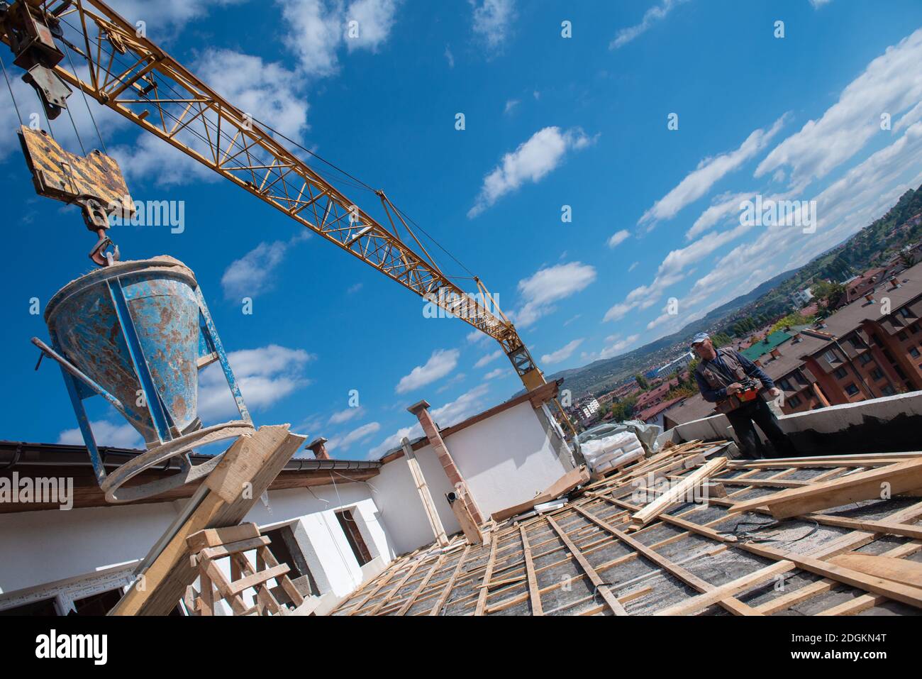 Construction worker installing a new roof Stock Photo
