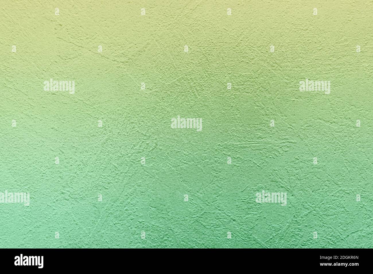 Green concrete background with abstract textured pattern applied to the surface. Stock Photo