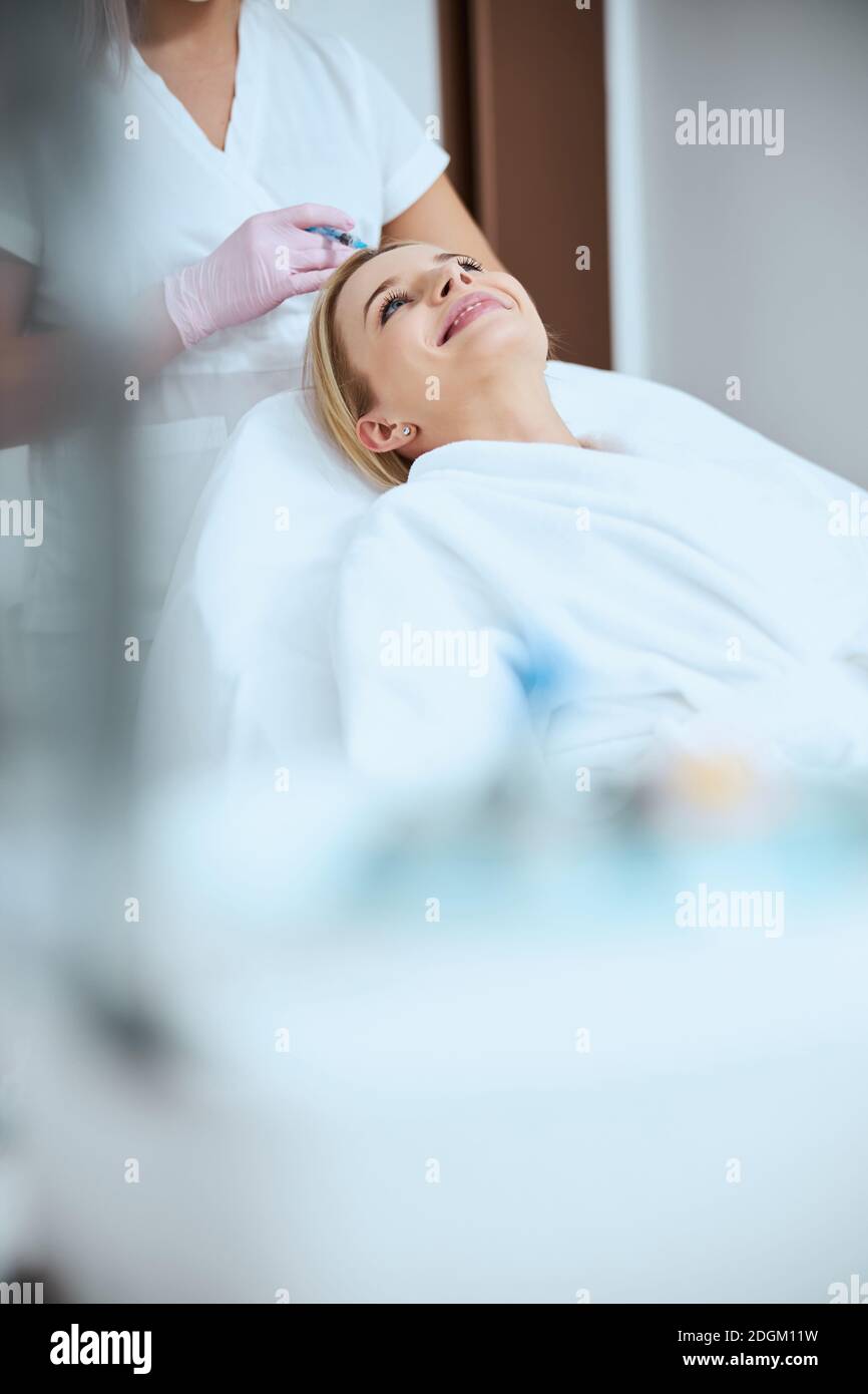Patient being injected the platelet-rich plasma into the scalp Stock Photo