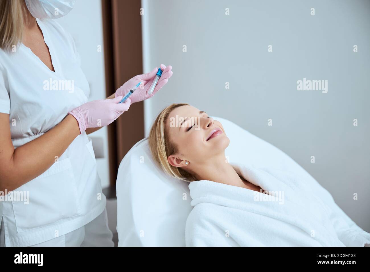 Doctor preparing for administering the platelet-rich plasma injection Stock Photo