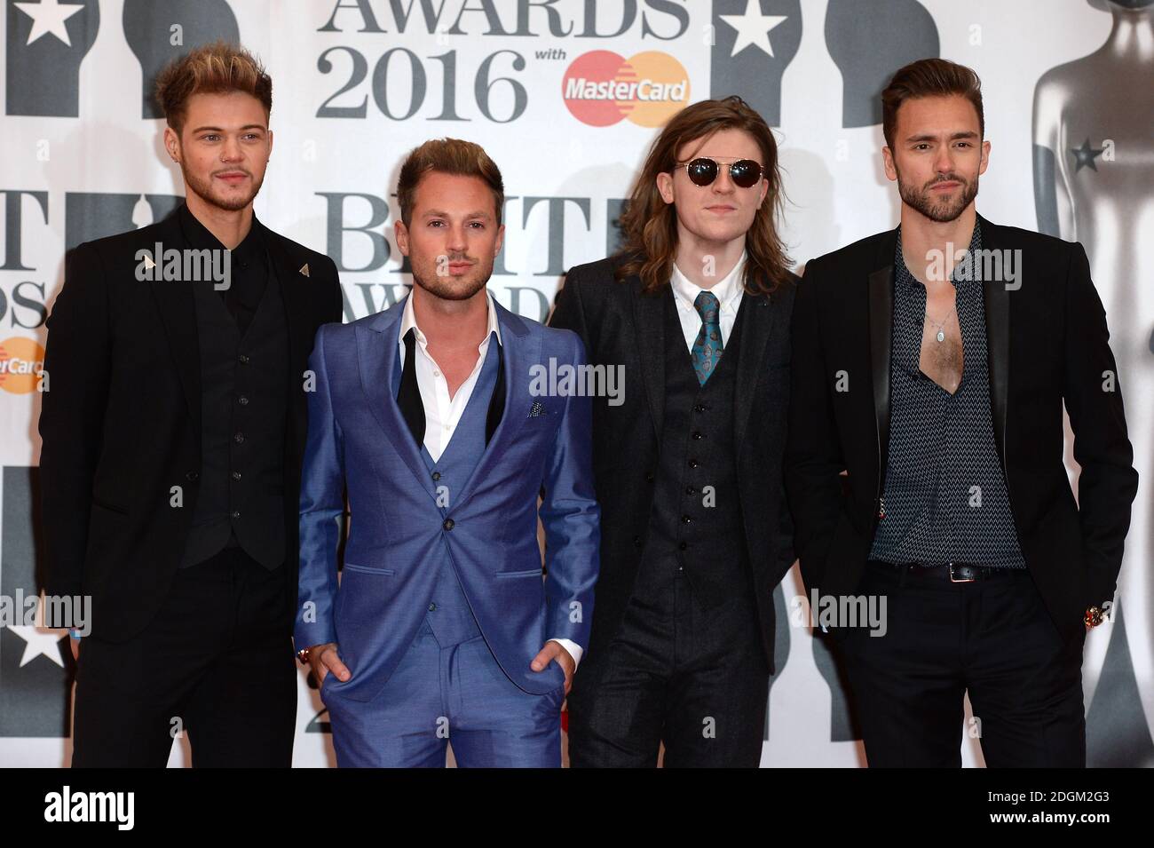 Ryan Fletcher (left), Adam Pitts (second right), Joel Peat (second right) and Andy Brown (right) of Lawson arriving for the 2016 Brit Awards at the O2 Arena, London. Stock Photo
