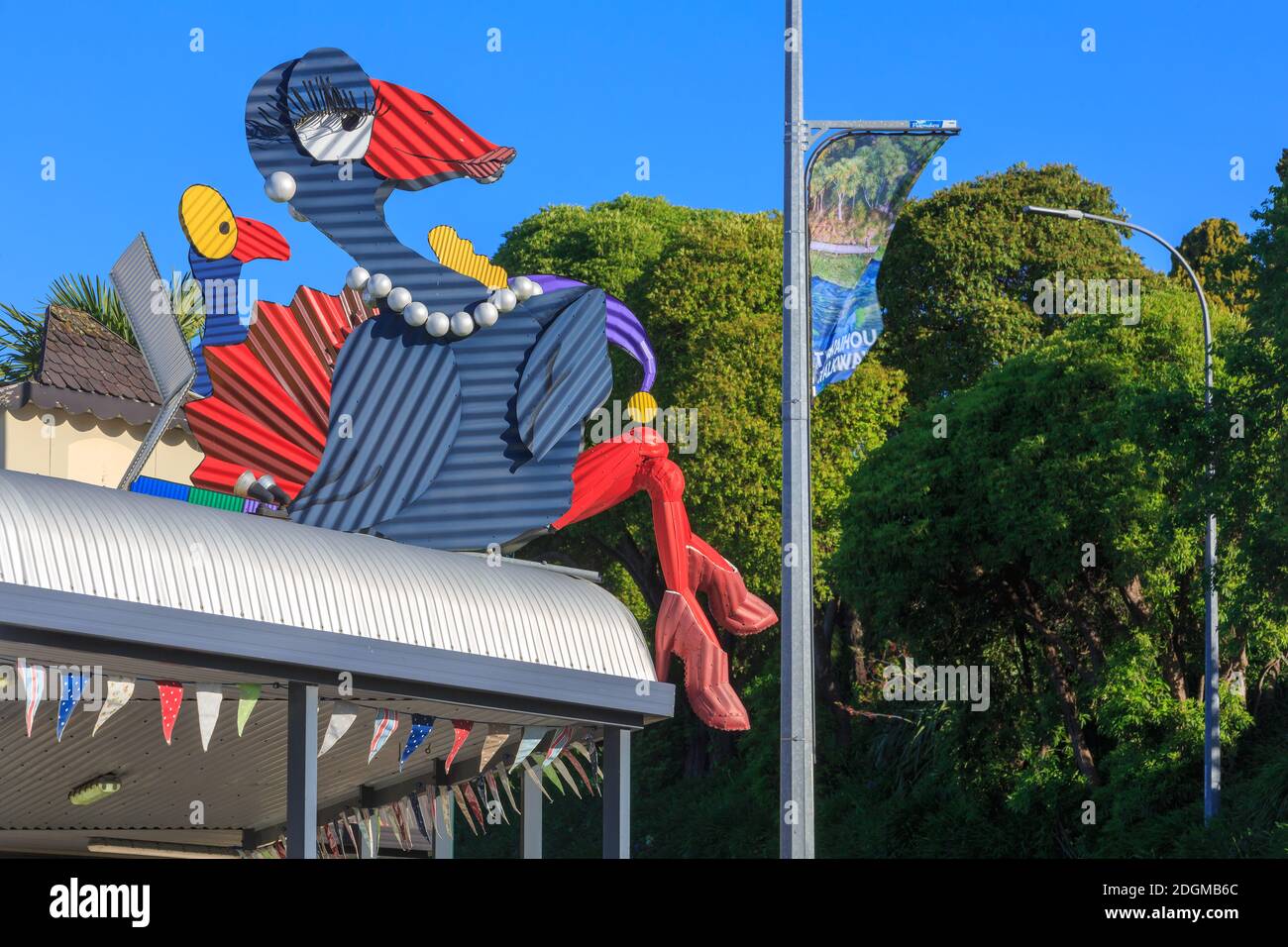 A corrugated iron sculpture of a pukeko (native bird) wearing a necklace on the roof of a jewelry store in Tirau, New Zealand Stock Photo