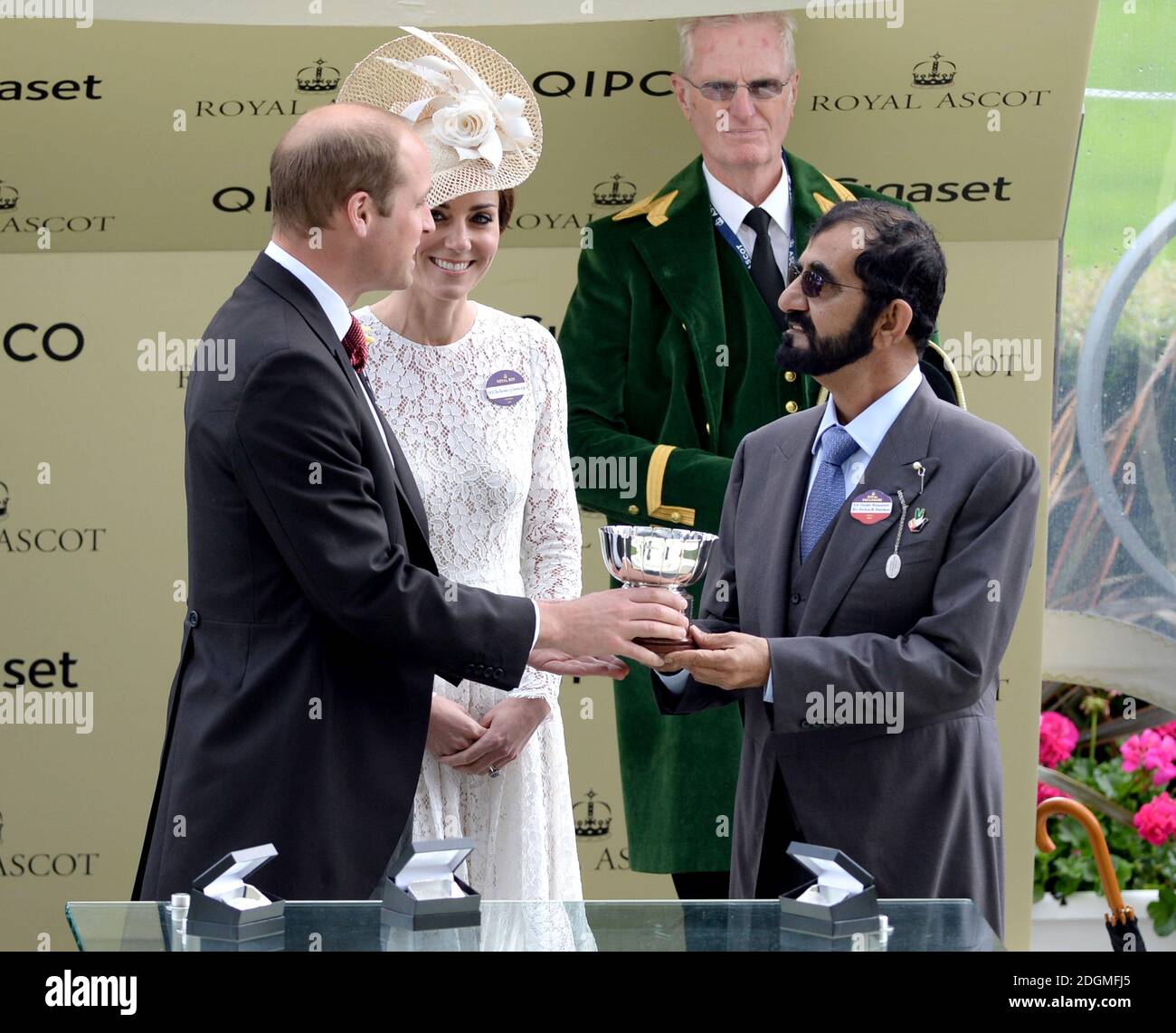 The Duke and Duchess of Cambridge present owner Mohammed bin Rashid Al Maktoum with the trophy after his horse Usherette won the Duke of Cambridge Stakes during day two of Royal Ascot 2016, at Ascot Racecourse. Stock Photo