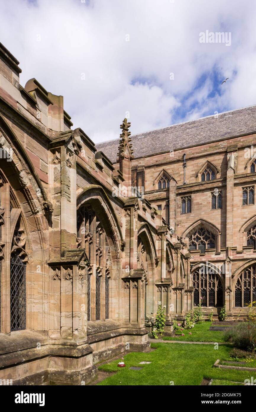 The cloisters as seen from the gardens, Worcester Cathedral, Worcester, UK; earliest parts of the building date from the 11th century. Stock Photo