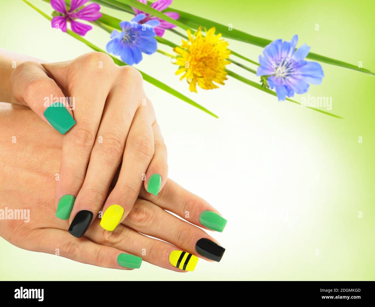 Nail Art, Spring nail designs with spring flowers on background Stock Photo  - Alamy