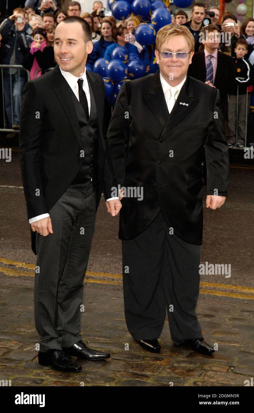 Sir Elton John and partner David Furnish leave the Guildhall in Windsor today after getting married on the first day gay civil partnerships became legal in England . Doug Peters/allactiondigital.com Stock Photo