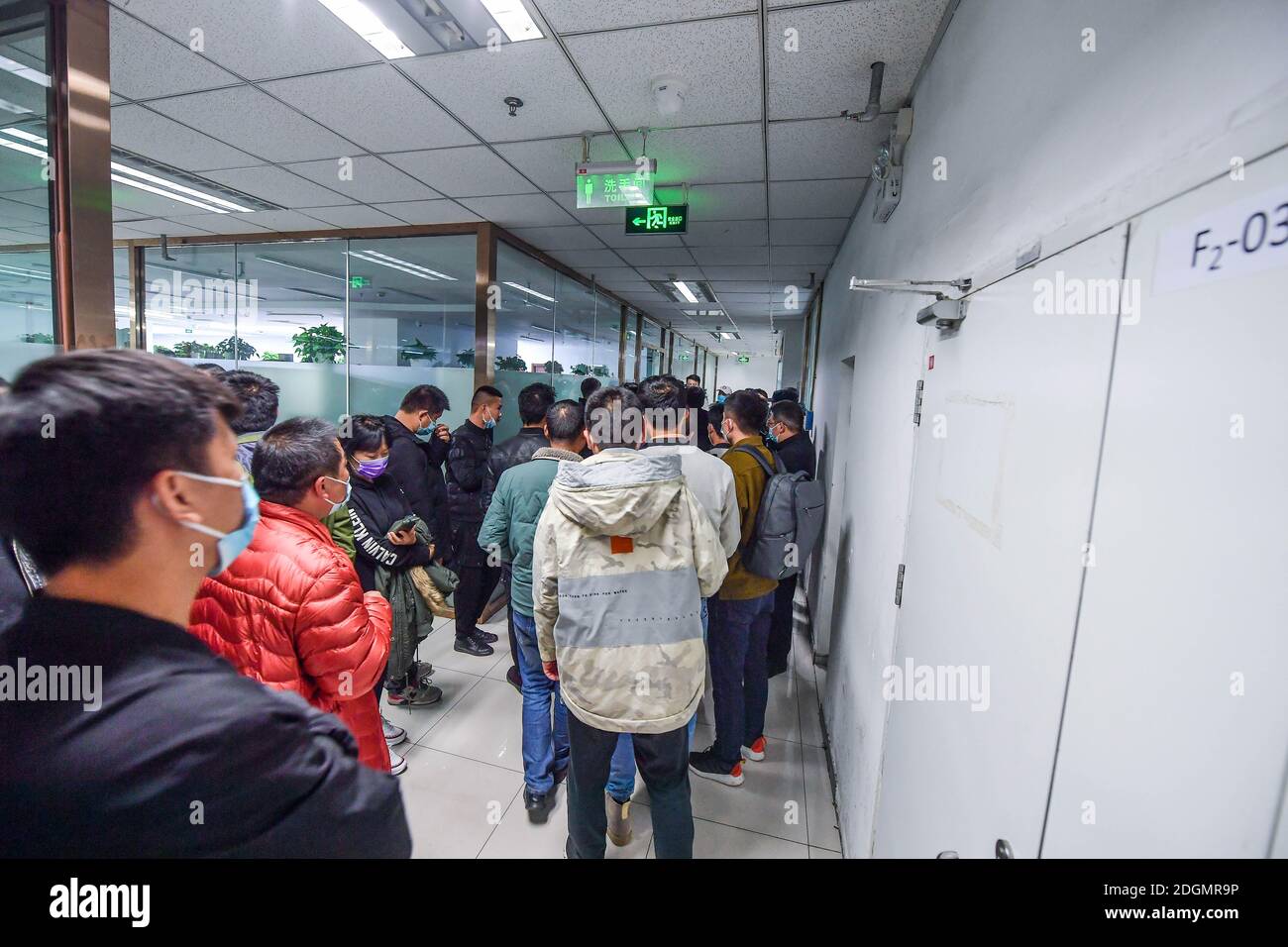 People gather at the headquarter of Danke Apartment in Beijing fighting for their legal rights in Beijing, China, 10 November 2020. Stock Photo
