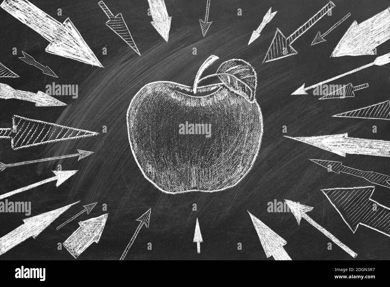 Many different arrows and apple as a target in the center drawn in chalk on a blackboard. Concept of competition, strategy, accuracy. Stock Photo