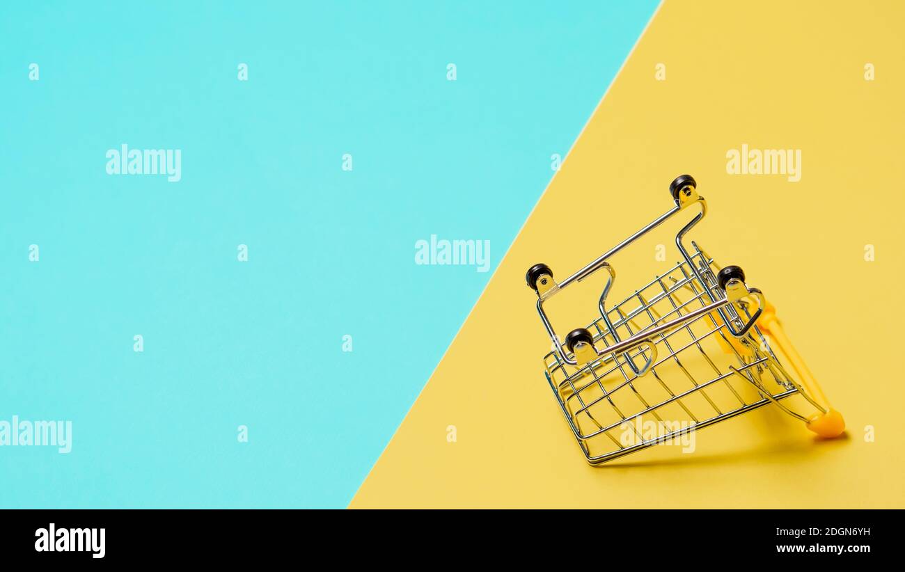 Empty inverted shopping cart, copy space Stock Photo