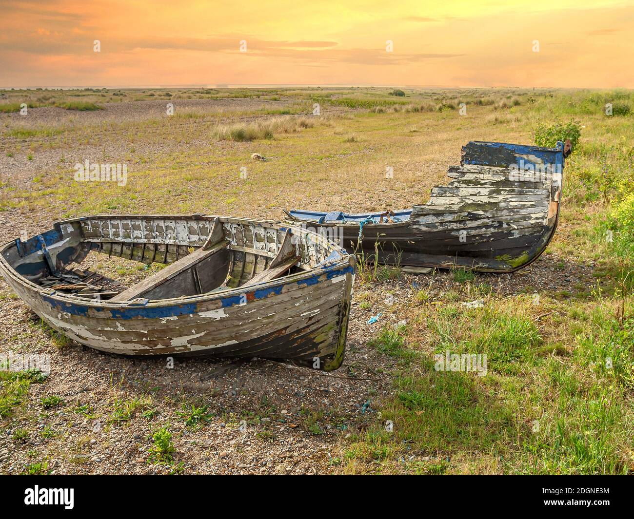 Wrecked hulks of fishing Boats lying in a Coastal Marsh Landscape near Kessingland, East Anglia, England Stock Photo