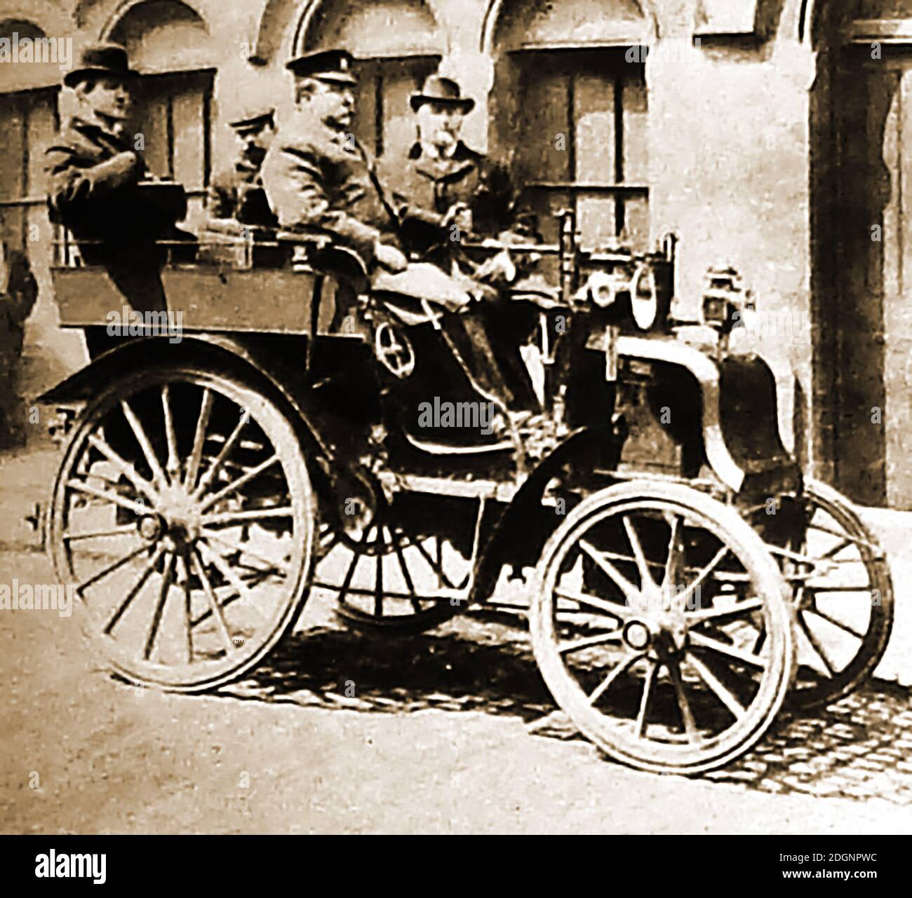 An 1890's photograph of a wealthy Packard motor car owner  with his  uniformed chauffer. (The two men in the rear are not in the car).  The photo must have been taken in the USA as  these luxury automobiles were built by the Packard Motor Car Company of Detroit, Michigan, starting in in 1899. The last Detroit-built Packard was the Packard Predictor, their last concept car, produced in 1956. The company became Studebaker-Packard Corporation of South Bend, Indiana where the1957 & 1958 'Packards' were actually made. Founders were  James Ward Packard, his brother William & George Lewis Weiss. Stock Photo