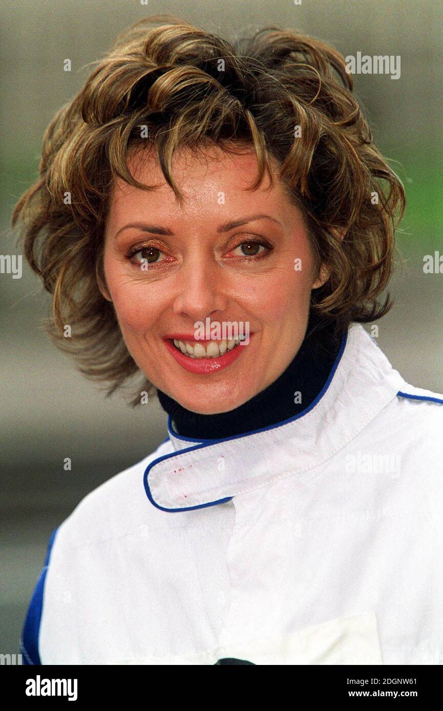 Television presenter Carol Vorderman donning her racing overalls as she