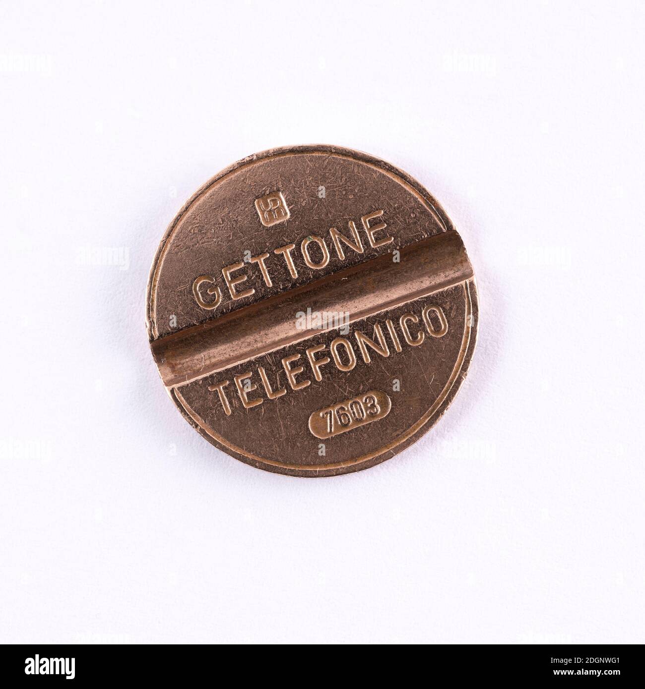 an old telephone token for Italian public telephones Stock Photo