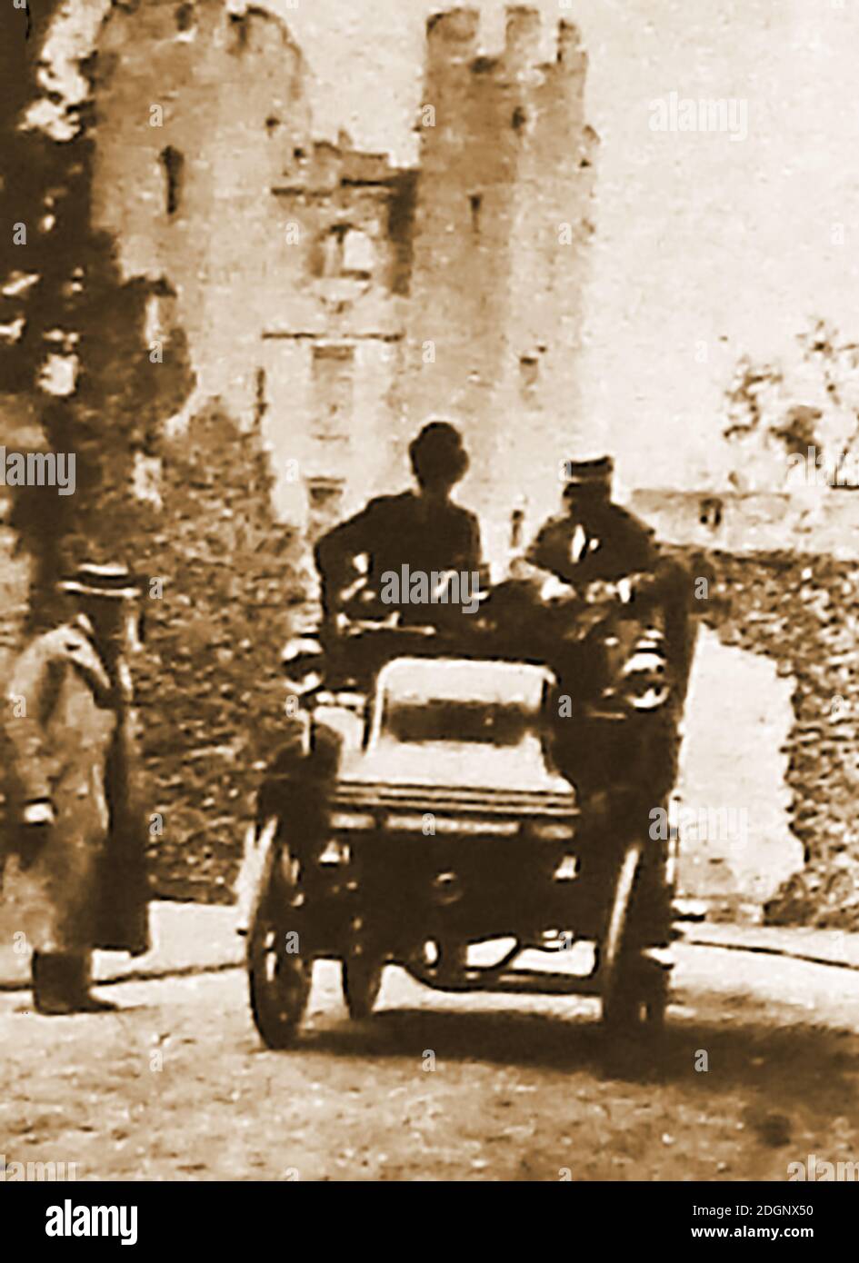 1898 photograph of a new motor car being demonstrated to an English aristocrat in the grounds of his castle, at a time when only the rich could afford to buy a car outright. Stock Photo