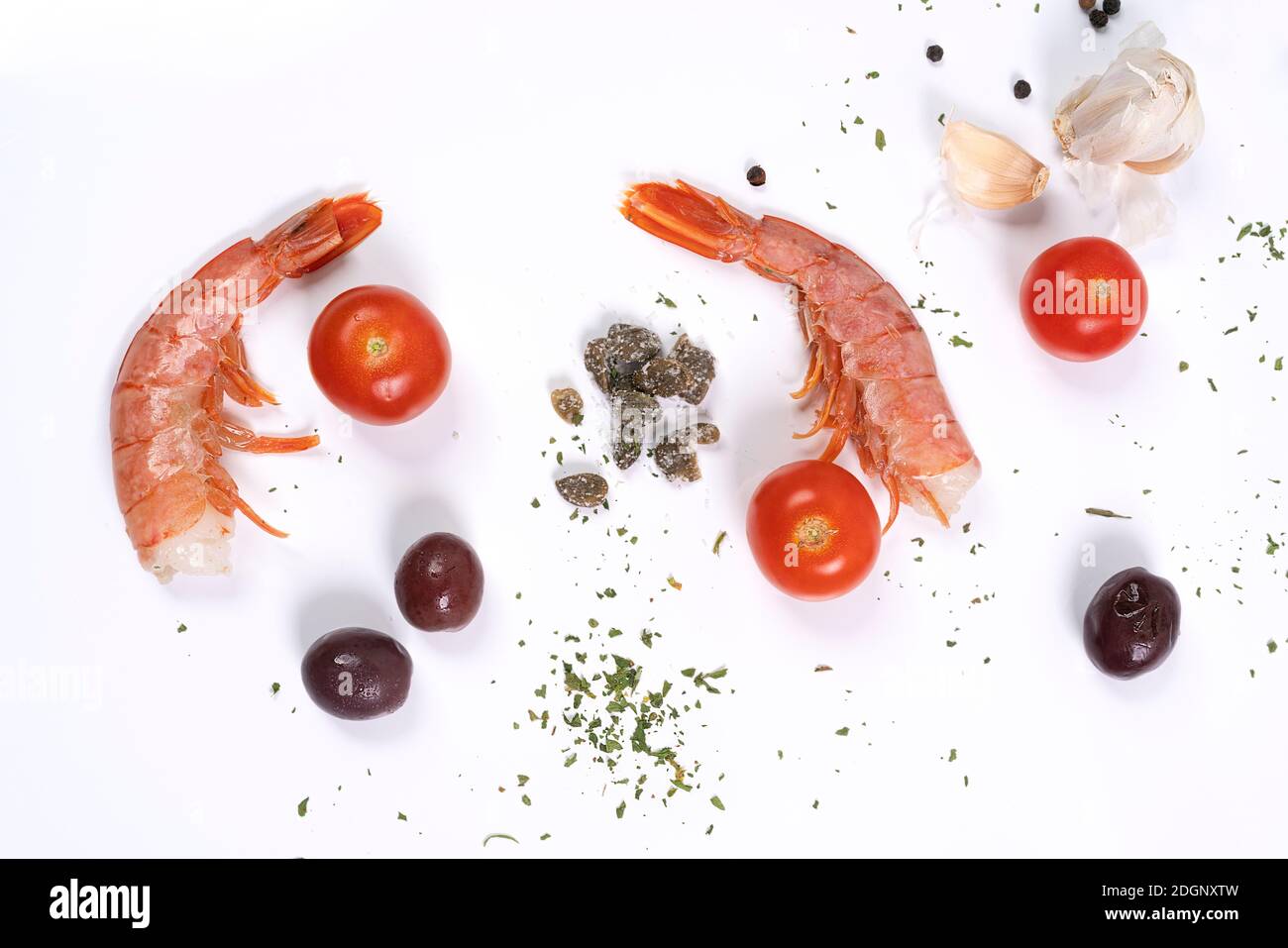 the ingredients to prepare the prawns on a stone surface Stock Photo