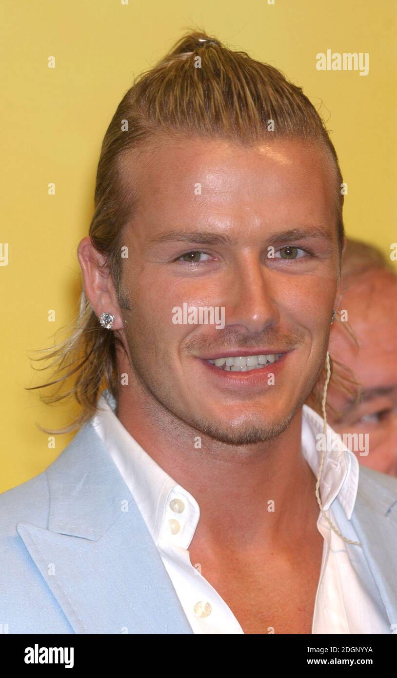 David Beckham is unveiled as a Real Madrid player at a press conference at  the Bernabeu. Headshot, earrings, ponytail. Â©Doug Peters/allaction.co.uk  Stock Photo - Alamy