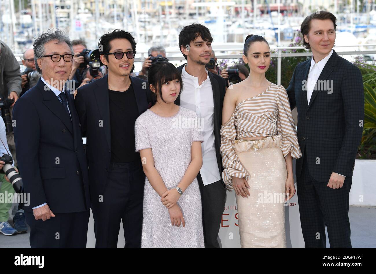 Byung Heebong, Steven Yeun, Ahn Seo-Hyun, Devon Bostick, Lily Collins and Paul Dano attending the Okja photocall as part of the 70th Cannes Film Festival. Photo credit should read: Doug Peters/EMPICS Entertainment Stock Photo
