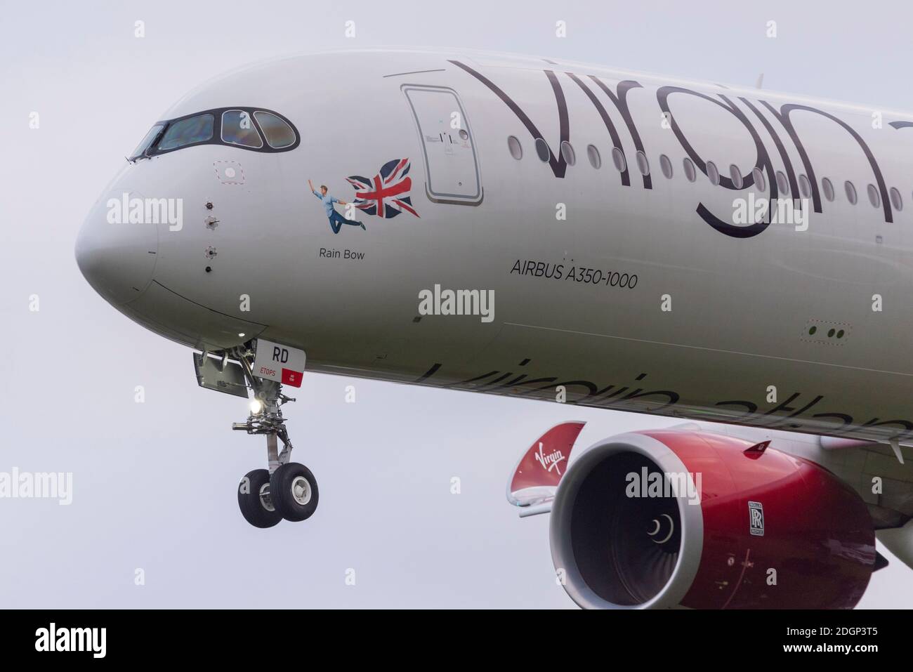 London Heathrow Airport, London, UK. 9th Dec, 2020. Overnight rain has cleared into a cloudy cool morning as the first arrivals land at Heathrow. One of the early arrivals was Virgin Atlantic's Airbus A350 named Rain Bow in support of LGBTQ+. Gay pride Stock Photo