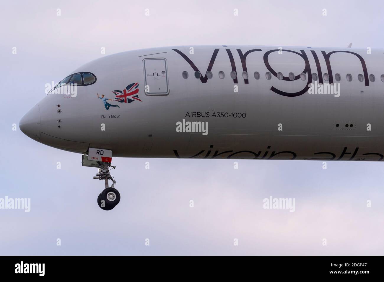 London Heathrow Airport, London, UK. 9th Dec, 2020. Overnight rain has cleared into a cloudy cool morning as the first arrivals land at Heathrow. One of the early arrivals was Virgin Atlantic's Airbus A350 named Rain Bow in support of LGBTQ+. Gay pride Stock Photo