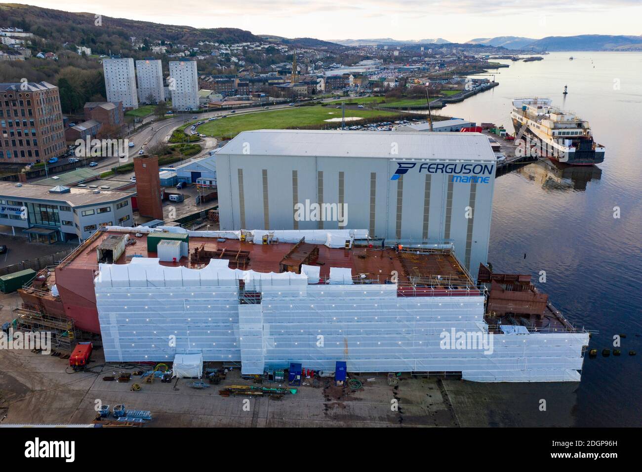 Port Glasgow, Scotland, UK. 9 December 2020. Aerial view of CalMac ferry MV Glen Sannox and Hull 802 ( unnamed second ferry) under fabrication at Ferguson Marine shipyard in Port Glasgow. The Scottish Parliament's Rural Economy and Connectivity Committee publish damning report criticising all aspects of the over budget and overdue project. Iain Masterton/Alamy Live News Stock Photo