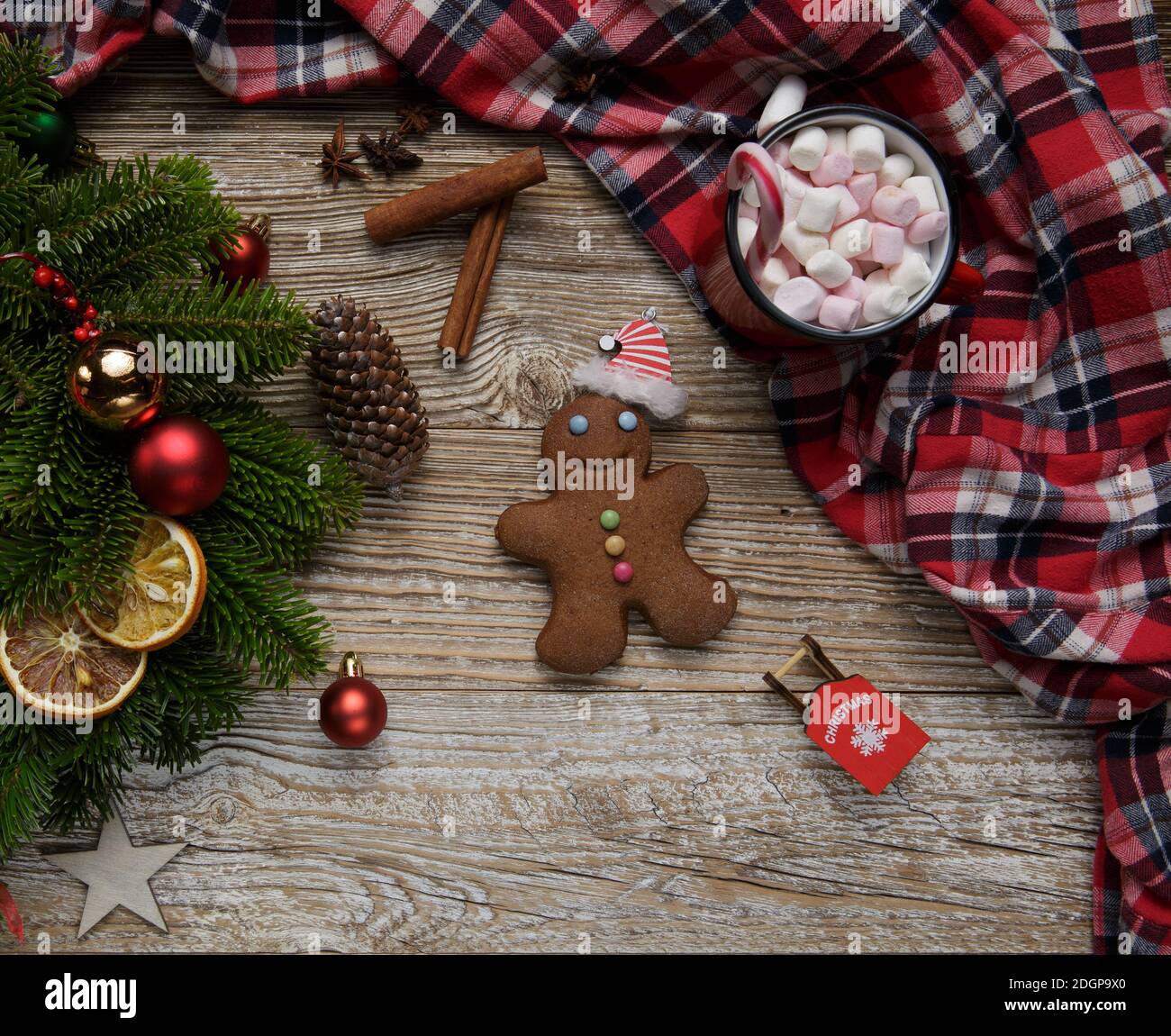 decorated Christmas wreath on a wooden old table. near toys and gingerbread Stock Photo