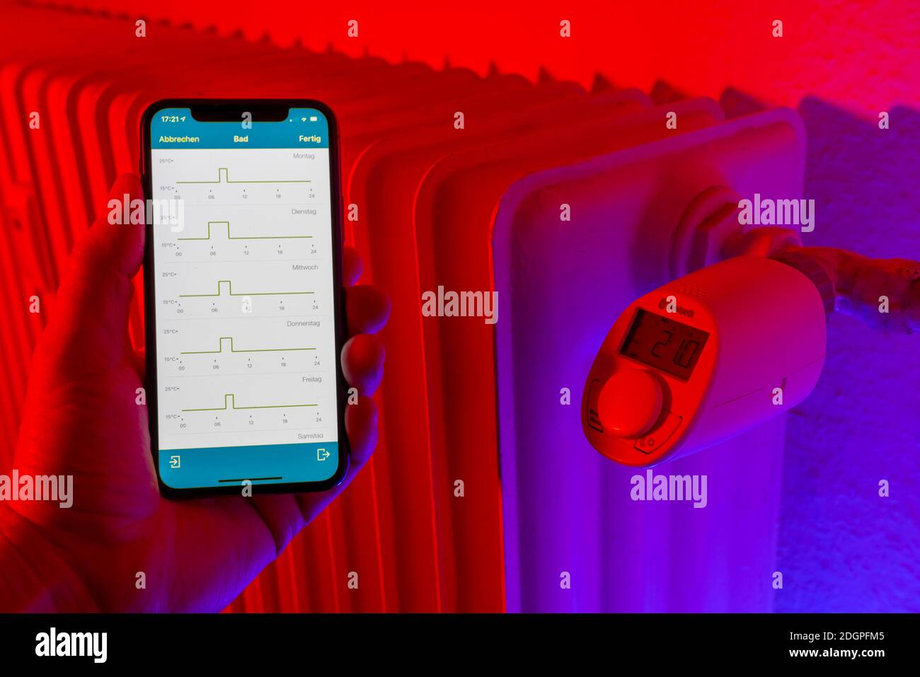 Smart Home application, control of heating, room temperature via Bluetooth, via mobile phone, smart phone app, Stock Photo