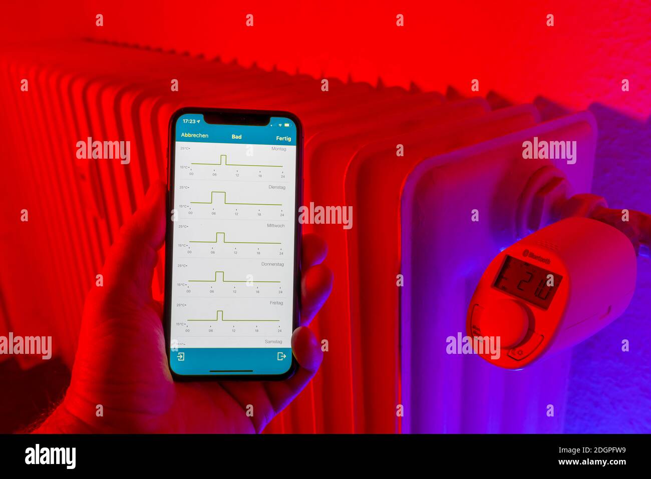 Smart Home application, control of heating, room temperature via Bluetooth, via mobile phone, smart phone app, Stock Photo
