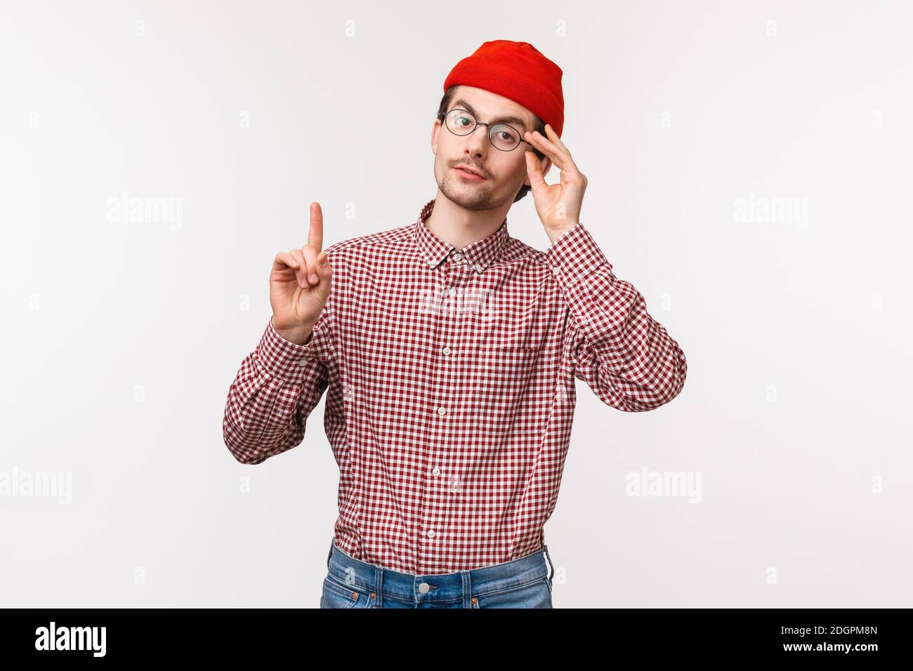 Waist-up portrait of smart and snobbish man patronising someone, scolding someone or correct person, raise one finger adding his Stock Photo