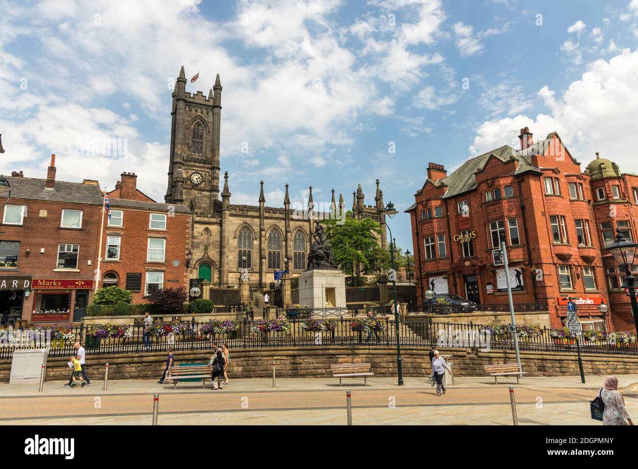 Cityscape of Oldham town centre, UK with Oldham Parish Church and War Memorial. Stock Photo