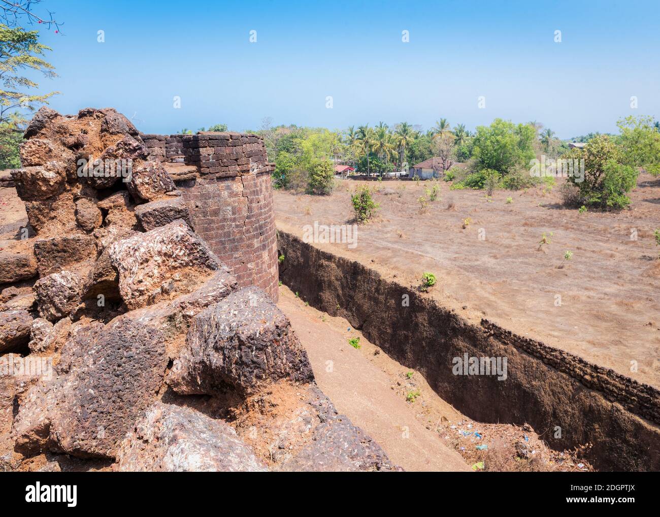 View of the old stone tower of the Portuguese fortress Fort Cabo De Rama near the village in Goa, India Stock Photo