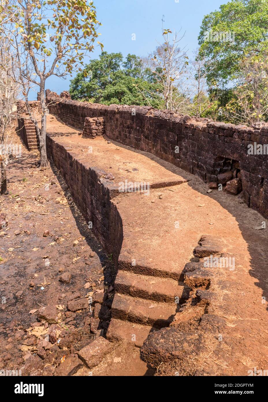 View of the old stone wall from inside Fort Cabo De Rama in Goa, India Stock Photo