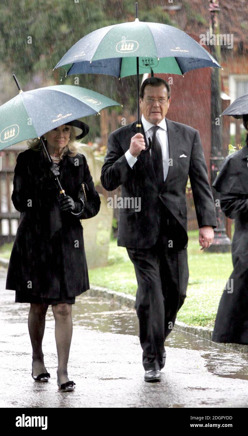 Actor Sir Roger Moore and wife attending the funeral of the late actor Sir John Mills in St Mary's Church, Denham, Buckinghamshire. Doug Peters/allactiondigital.com  Stock Photo