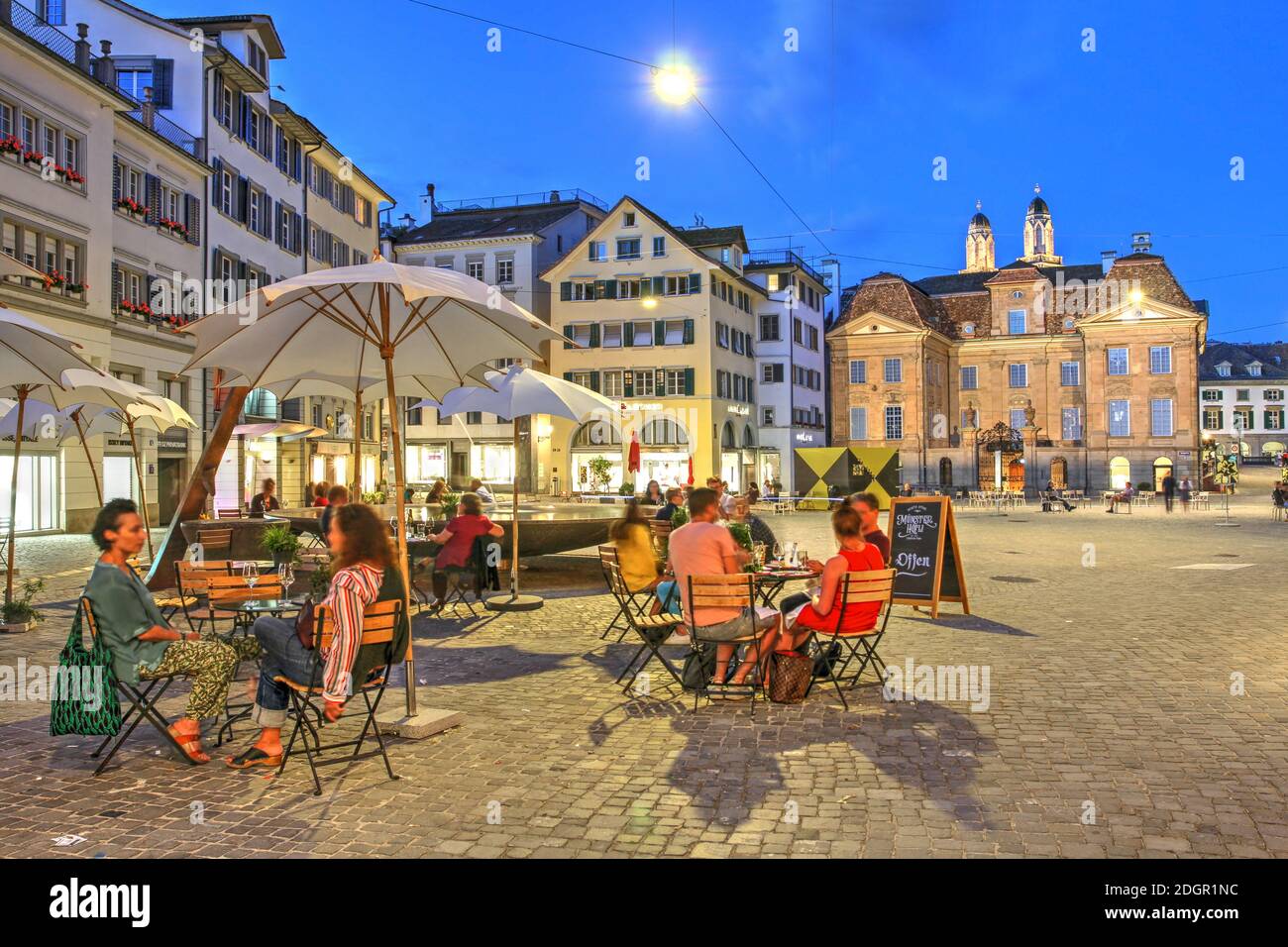 Zurich, Switzerland - June 27, 2020 - Night scene in Munsterhof Square in the Lindenhof quarter of Altstadt (old town) Zurich, Switzerland, featuring Stock Photo