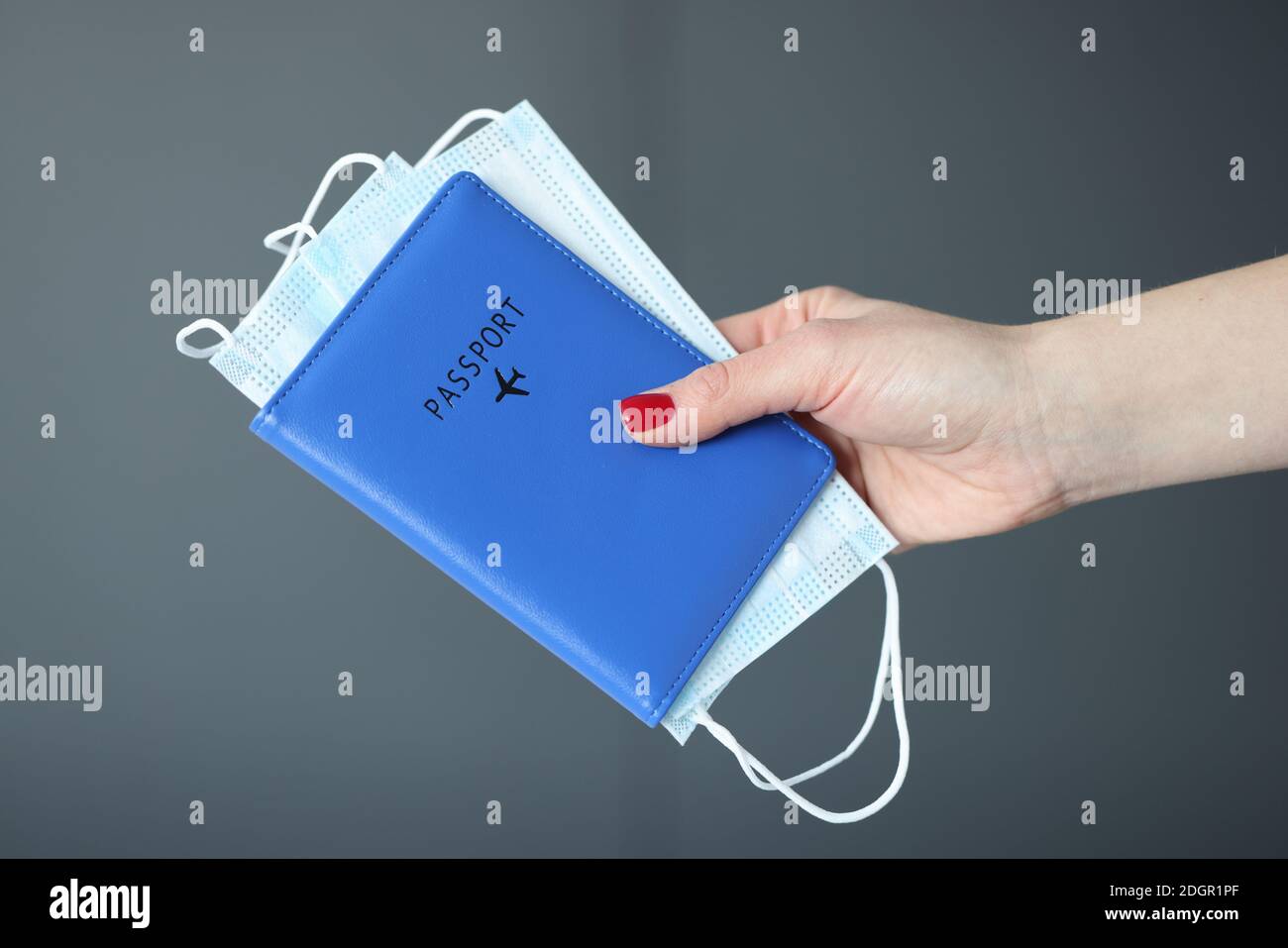 Hand holding facemask hi-res stock photography and images - Alamy