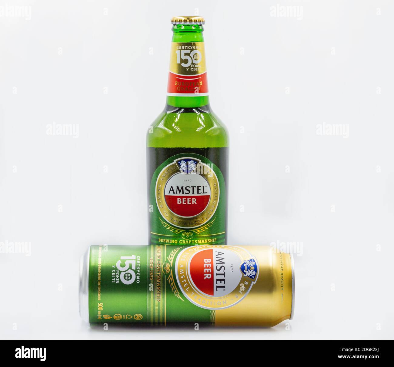 KYIV, UKRAINE - SEPTEMBER 14, 2020: Amstel beer can and bottle closeup against white background. Amstel is a Dutch brewery founded 1870 in Amsterdam. Stock Photo