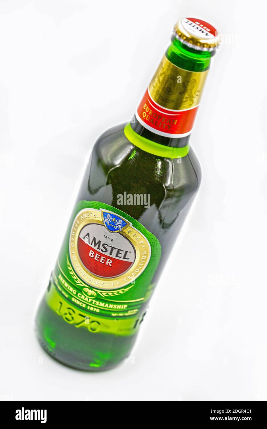 KYIV, UKRAINE - SEPTEMBER 14, 2020: Amstel beer bottle closeup against white background. Amstel is a Dutch brewery founded 1870 in Amsterdam. It was t Stock Photo