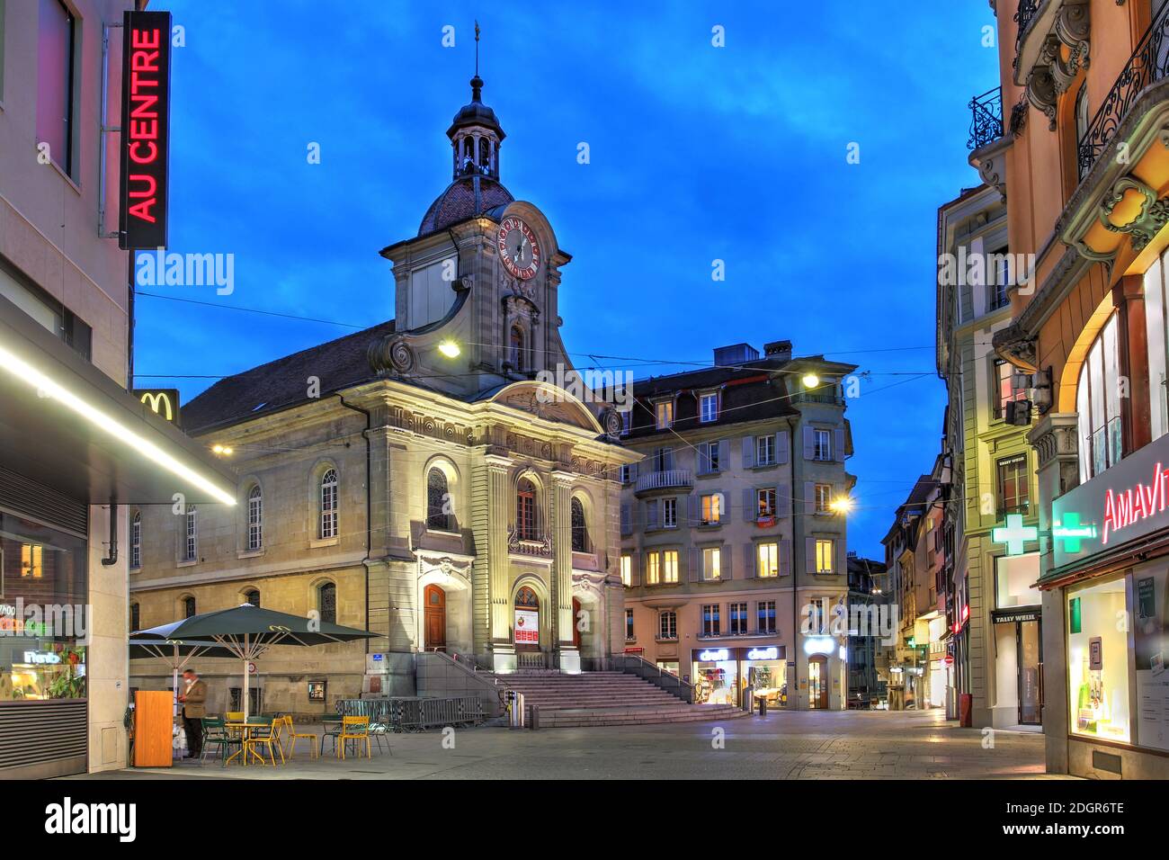 Night scene in Place St-Laurent, with Church of St-Laurent, the commercial center of the Lausanne, Switzerland, yet often overlooked by photographers Stock Photo