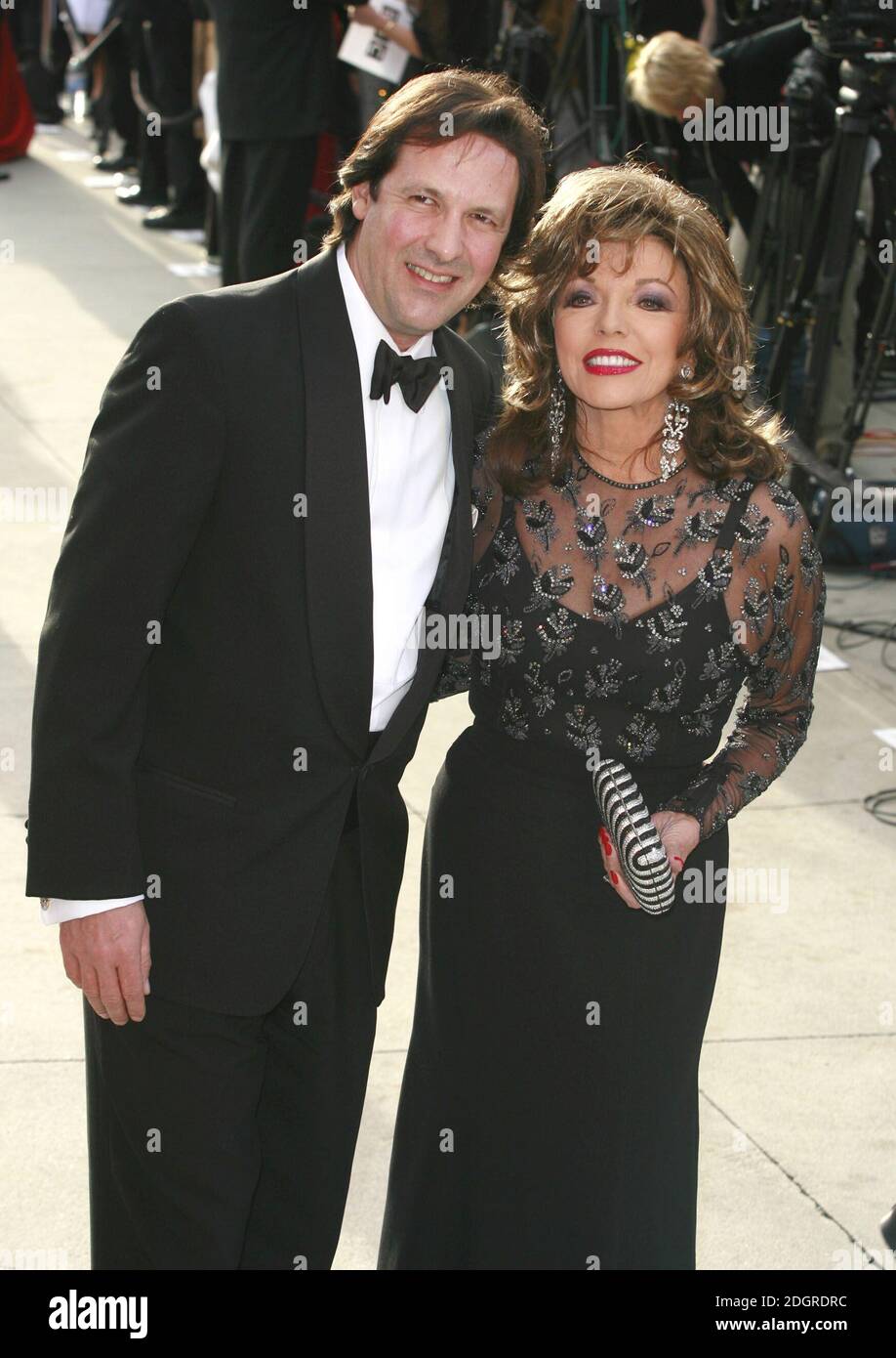 Joan Collins and Percy Gibson arriving at the Vanity Fair Oscars Party ...