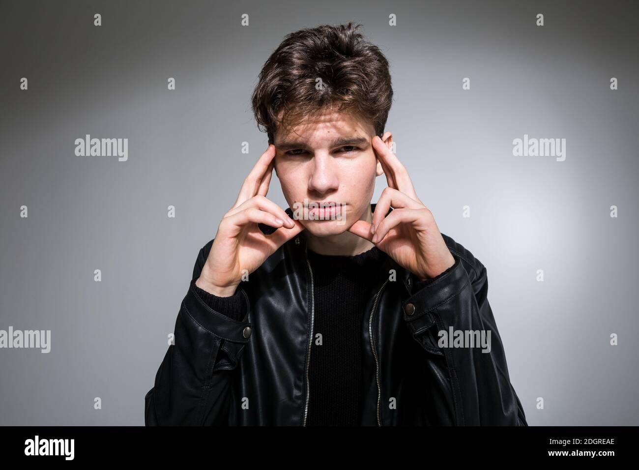 Wide angle. Studio shot. Young caucasian guy model in black clothes ...